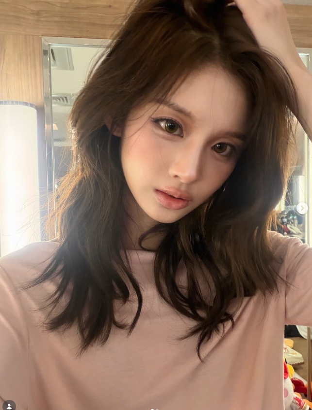 Seoyun (NMIXX) Perfects the Art of the Cutesy-Cool Pivot: From Ribboned Romance to Halter-Neck Heat