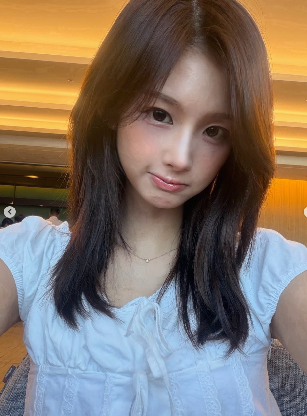 Seoyun (NMIXX) Perfects the Art of the Cutesy-Cool Pivot: From Ribboned Romance to Halter-Neck Heat