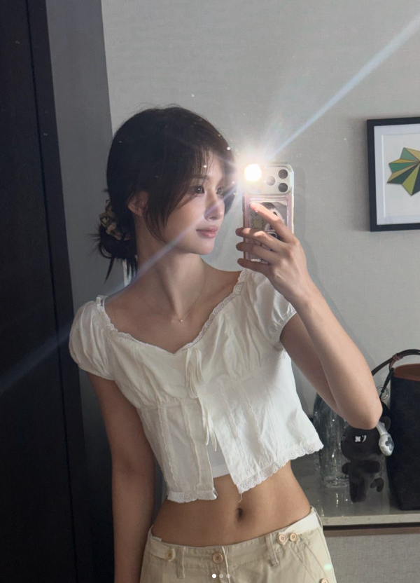 Seoyun (NMIXX) Perfects the Art of the Cutesy-Cool Pivot: From Ribboned Romance to Halter-Neck Heat