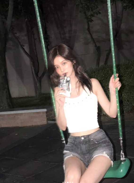 Seoyun (NMIXX) Perfects the Art of the Cutesy-Cool Pivot: From Ribboned Romance to Halter-Neck Heat