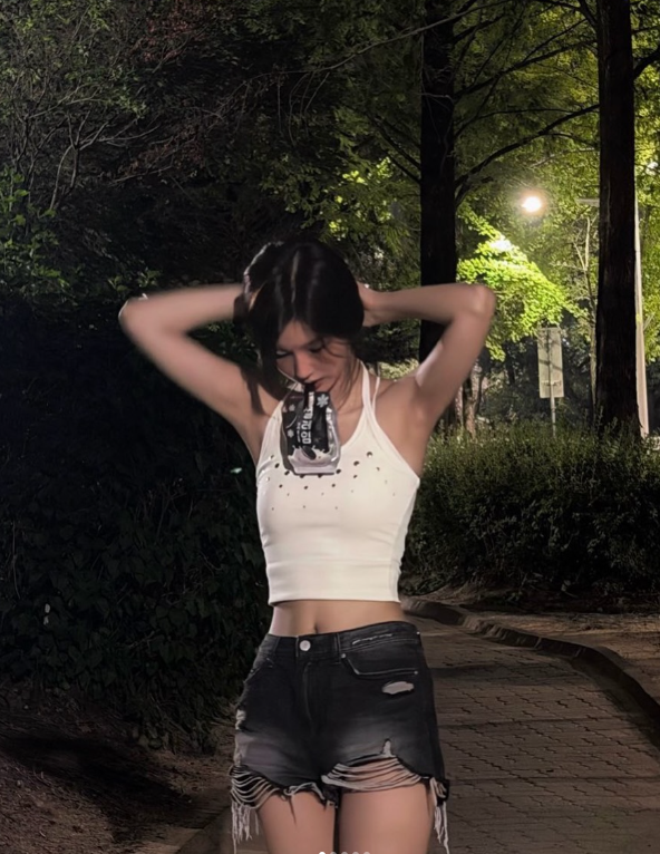 Seoyun (NMIXX) Perfects the Art of the Cutesy-Cool Pivot: From Ribboned Romance to Halter-Neck Heat