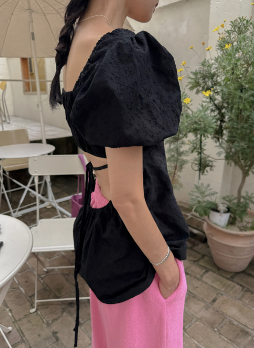 The Back Slit Blouse That Finally Makes Sitting Down Comfortable