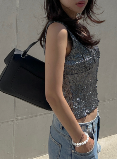 Night resort photoshoots look magazine-ready in this metallic vest — here's why everyone wants one now