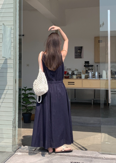 One dress, three seasons, basically infinite looks—the cotton maxi that earns its closet space