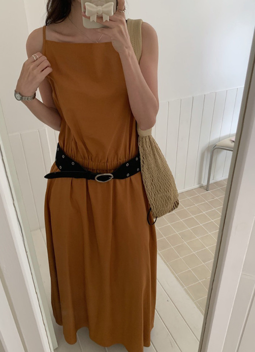 One dress, three seasons, basically infinite looks—the cotton maxi that earns its closet space