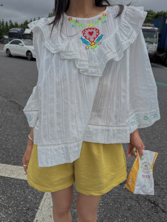 Broader shoulders? This ruffle blouse solves the whole upper-body coverage situation