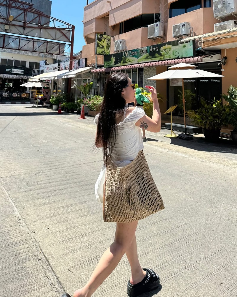 The Singer With Layers: Jo Hyeon-a Proves You Can't Fail in a Saint Laurent Raffia Bag & Summer Travel Look