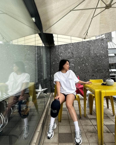 The Singer With Layers: Jo Hyeon-a Proves You Can't Fail in a Saint Laurent Raffia Bag & Summer Travel Look