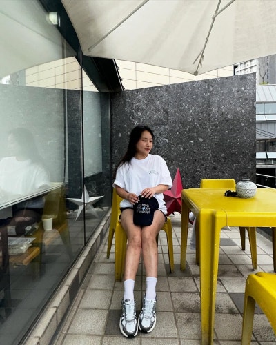 The Singer With Layers: Jo Hyeon-a Proves You Can't Fail in a Saint Laurent Raffia Bag & Summer Travel Look