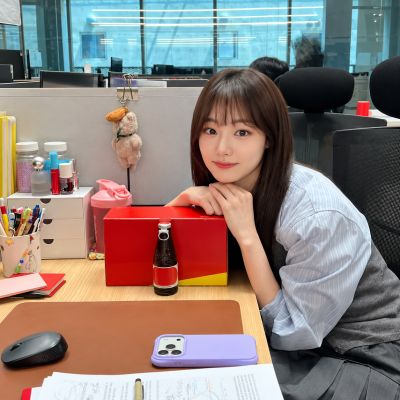 "She missed out on the I.O.I 10th-anniversary reunion..." but in the drama, she returns as a company employee in her fifth year.